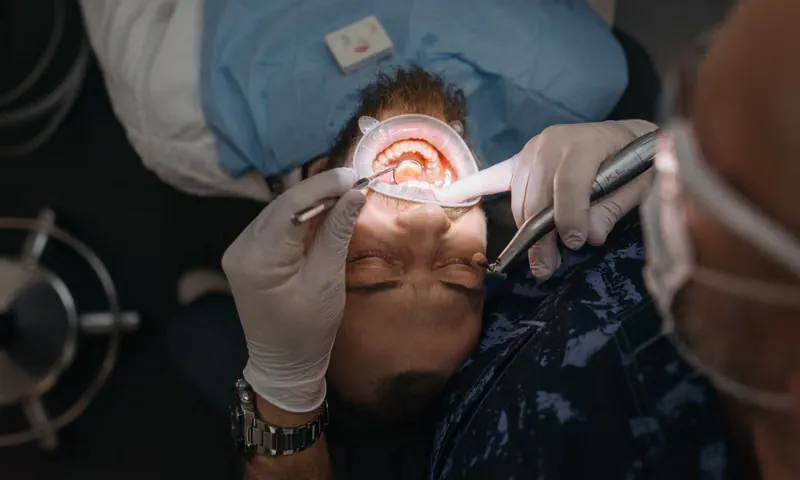 Orthodontist reviewing digital dental X-ray on computer screen for treatment planning at Deekshu Dental Sarjapura Bangalore