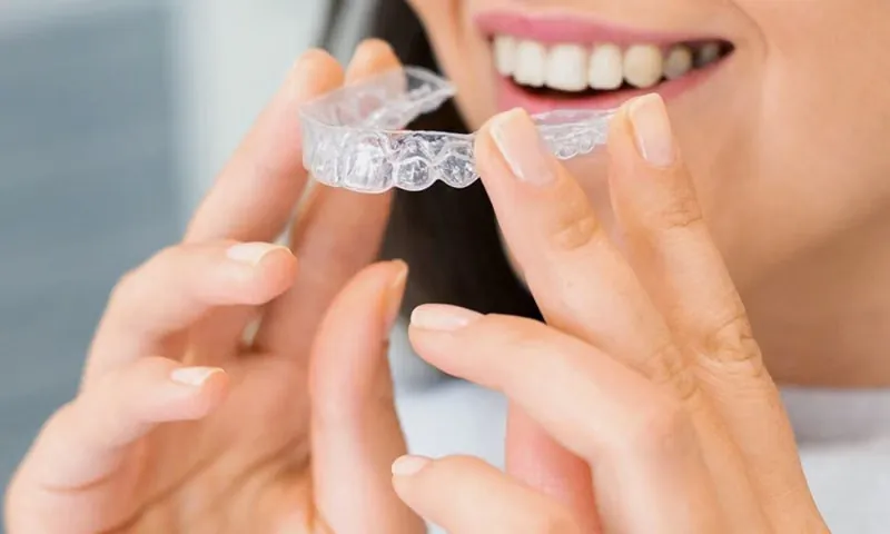 Clear Invisalign aligner trays displayed in modern dental clinic in Sarjapura Bangalore