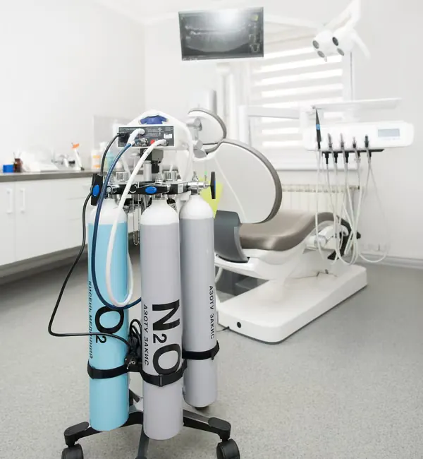 Nitrous oxide nasal mask placed gently for inhalation sedation dental treatment at Sarjapura Bangalore clinic